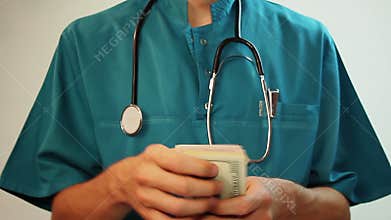 Medical worker counting money, corruption, expensive healthcare