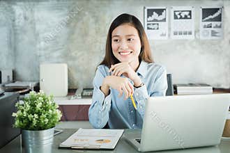 New generation asians business woman using laptop at office,Asian women sitting smiling while working on mobile office concept