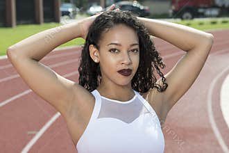 Stunning African-American fitness model on outdoor track