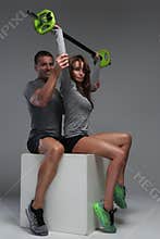 Muscular fitness men and a woman.