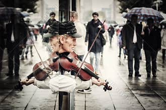 Street artist playing violin