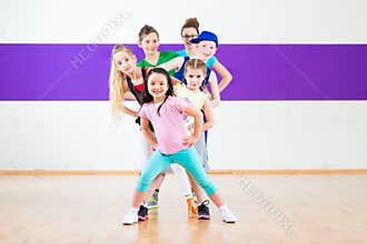 Kids train Zumba fitness in dancing school
