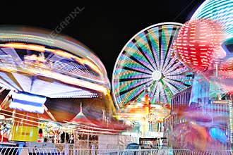 Carnival and Ferris Wheel at Night - Bright Lights and Long Exposure