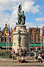 Travellers rest near the statue