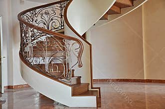 Spiral spiral staircase inside the house.