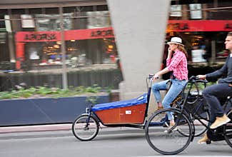 People cycling on the street in Amsterdam city