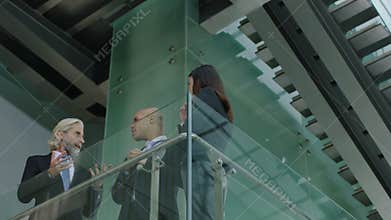 Multiethnic business people talking in office building