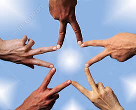 Five hands building a star