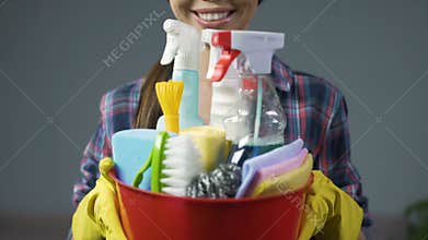 Happy cleaning service employee ready to start working, positive work attitude