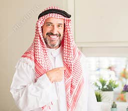 Handsome senior man with hijab at home