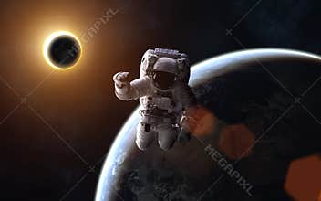 Astronaut. Solar eclipse. Moon and Earth