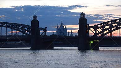 Smolny Cathedral in the alignment of the bridge of Peter the great late in the evening. Saint Petersburg, Russia