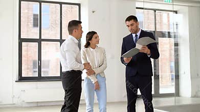 Realtor with folder showing documents to customers