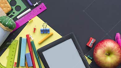 Banner Concept back to school apple backpack stationery on black background.