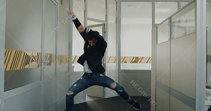 Young business men are very excited after the interview, one worker walked behind him and smiling.