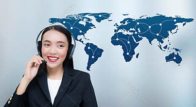 Beautiful asian woman smiling customer service talking on headset with world map communication.