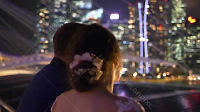 Beautiful elegant couple in the city during evening