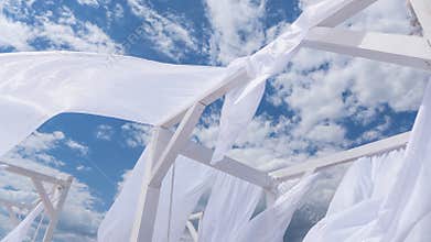 Flying in the wind fabric from the beach canopies on the beach