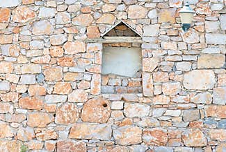 Vintage stone wall with different geometric shapes