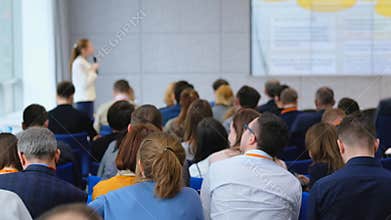 Audience listens to the lecturer at the conference