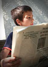Boy Reading the News
