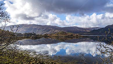 A beautiful mirror image of the sky at Loch Sunart in the Highlands of Scotland