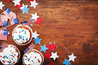 Cupcake decorated with american flag for happy Independence Day 4th july background. Holidays table top view.