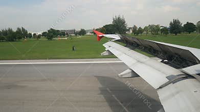 View from airplane window between landing time on runway of airport destination