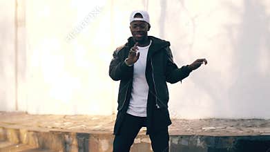 Black man dancing at the street