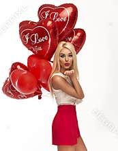 blond woman with red heart balloons