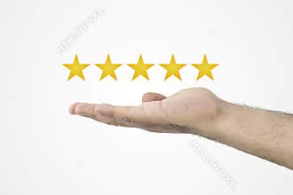 Customer review concept.. Rating golden stars. Feedback, reputation and quality concept. Hand holding golden five star rating.