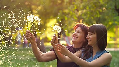 Adult daughter hugging her senior mother
