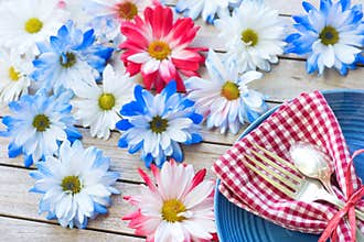 Picnic Table Setting in Red White and Blue Colors for July 4th Celebration on Wood Board Background Table with room or space for c