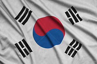 South Korea flag is depicted on a sports cloth fabric with many folds. Sport team banner