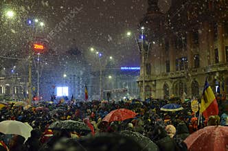 Anti government protests in Bucharest in inclement weather.