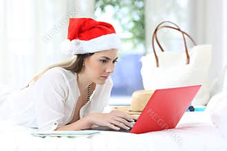 Woman on christmas holidays using a laptop