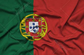 Portugal flag is depicted on a sports cloth fabric with many folds. Sport team banner