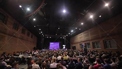 Brest, Belarus - MAY 9, 2018: Lots of young people at the conference. Sitting in a big hall. Listening to the speaker