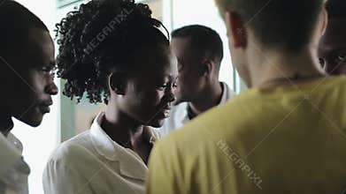 KENYA, KISUMU - MAY 20, 2017: Young beautiful people, women and man in white gown in African hospital.