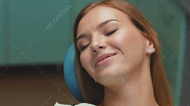 Happy smile of girl with orthodontic braces