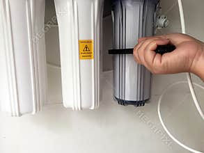Time to change water filters. Remove the filter do it yourself.
