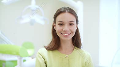 Portrait of happy dentist in dental clinic. Medical student in dentist office