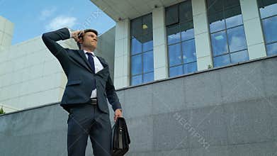 Businessman angry about bad news after phone call, deadline, fired from work