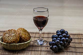 Mid-Autumn Festival - moon cakes, red wine and grapes