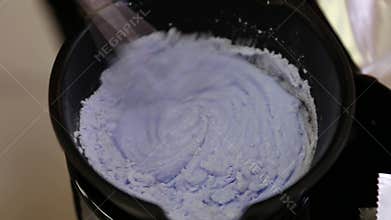 Hairdresser Mixing Hair Dye In Bowl In Hair Salon