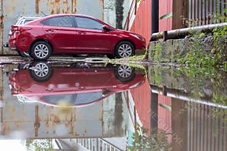 A large puddle in the courtyard after the rain