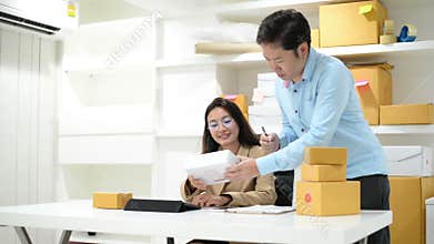 Small business entrepreneur SME freelance asian team man woman working box for delivery