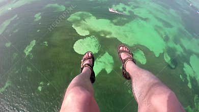 Legs in air parasailing