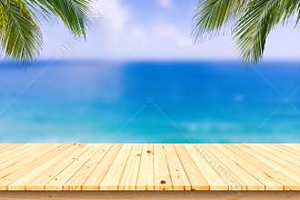 Wooden desk or plank on sand beach in summer. background.
