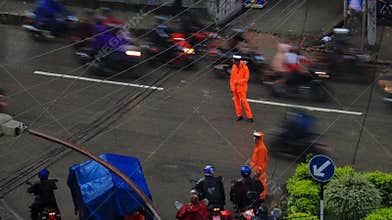 Traffic police working in the rain in Kathmandu, Nepal